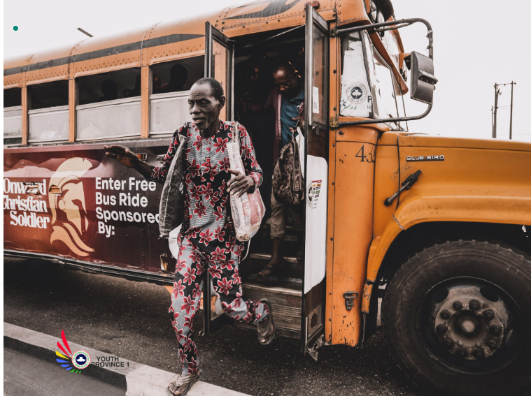 A passenger alighting from one of the free RCCG buses